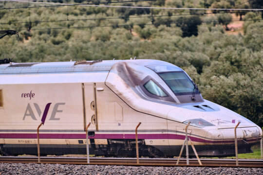 Renfe AVE High-Speed Train Passing Through Puertollano Castilla-La Mancha Spain On A Sunny Day