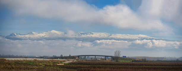 Snowy sierra nevada mountains over vega de granada