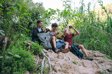 Family taking a break and planning route during nature hike