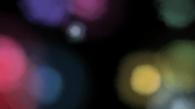 Abstract Bubbles of light : Soft, out-of-focus spheres of color float gently against a dark, velvety backdrop, creating a serene and ethereal mood. 