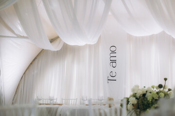 Romantic wedding reception tent decoration with te amo banner