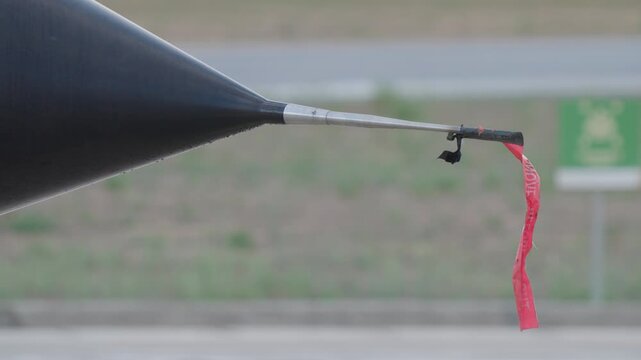 Fighter jet pitot probe covered with protective cap and remove before flight tag to prevent contamination and ensure accurate air data before mission