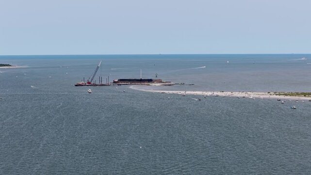 Drone footage showcases the historic Fort Sumter, situated on an island in Charleston Harbor, capturing its iconic brick walls and strategic coastal location from above