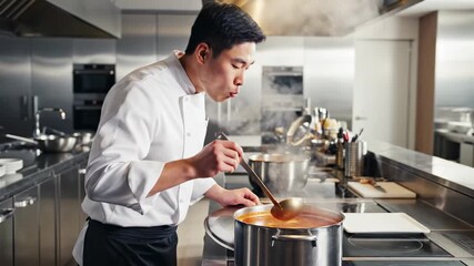 Chef stirs soup in busy kitchen. Focus on the pot as steam rises. Bright workspace emphasizes cooking process. Concept of culinary arts, gastronomy, restaurant
