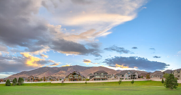 Homes overlooking mountain and a landscaped lawn