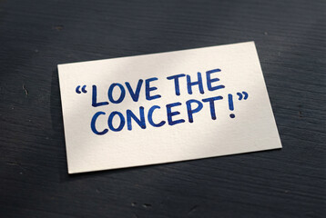 Love the concept handwritten quote card on dark wooden desk, inspirational feedback message for creative ideas.