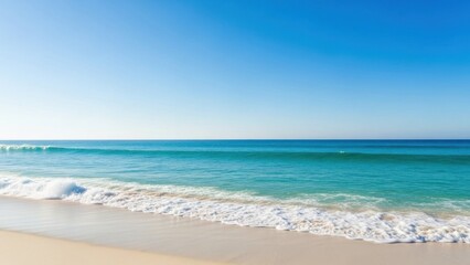 Vast azure ocean meeting a pristine sun-kissed sandy beach under a clear summer sky creating a
