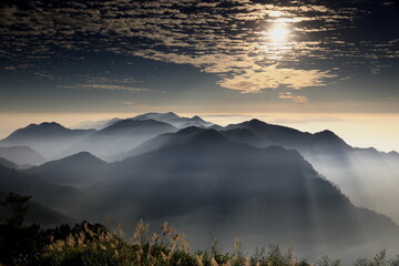 Majestic sea of clouds over mountains during golden sunrise, cinematic nature landscape high...