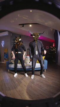 Gen Z creators gold mask dance challenge fan cam UGC trend sync performance fox bull mascot duo home studio vertical video for reels tiktok social content