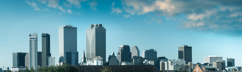 Fototapeta premium Aerial panorama of New Orleans highlighting skyline, river, and urban environment