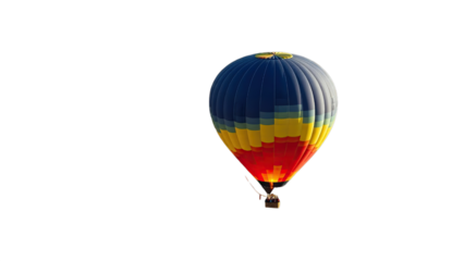 Colorful hot air balloon gracefully ascends against a stark completely black background