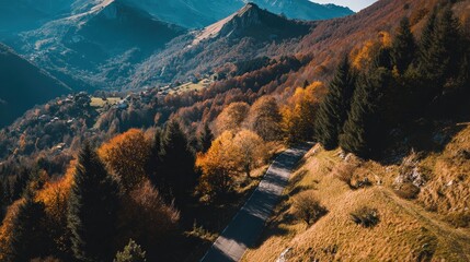 Mountain Road Leading to Alpine Village in Autumn