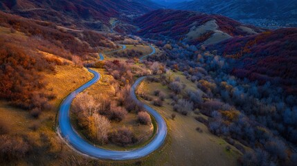 Aerial View of Winding Mountain Road in Autumn