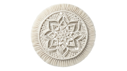 Isolated Boho style woven cotton yarn coaster with fringed edges for drinkware protection