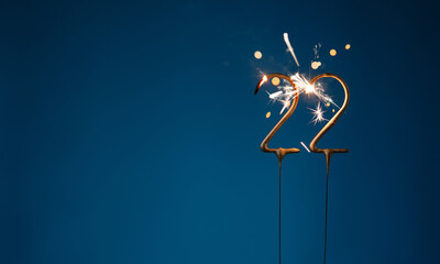 22 years celebration festive background with copy space made with Bengal fires in the form of number Twenty two.