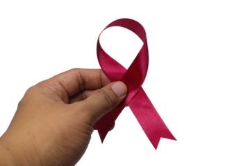 Hands holding red ribbon for World AIDS Day awareness