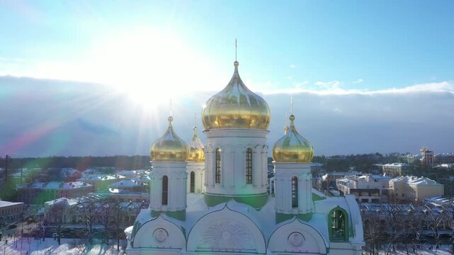 Golden domes of Catherine Cathedral gleaming in bright sunlight against a winter sky in Pushkin, Russia