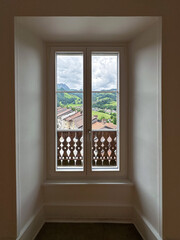 Scenic Window View of a Traditional Alpine Village