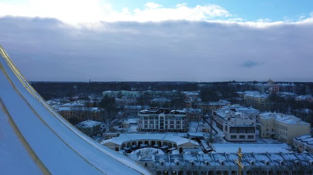 Detailed extreme close-up of the golden dome and cross of Catherine Cathedral in winter, Pushkin aerial view