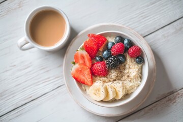 Healthy Breakfast with Oatmeal, Fresh Fruits and Coffee on Clean Wooden Table, Soft Natural Light, Minimal Composition, Wellness and Self Care Concept