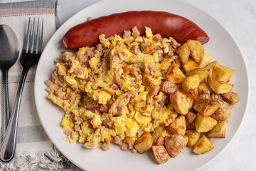 scramble eggs and corn beef hash  with  smoked sausage