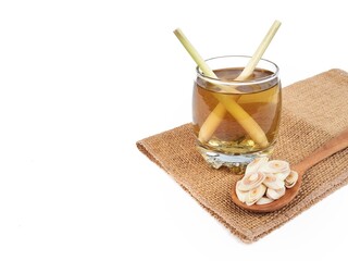 Lemongrass boiled water in glass with fresh lemongrass. Herbal drink for healthy lifestyle. Copy space 
