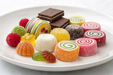 a plate with marmalade and chocolate candies