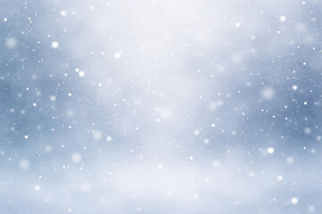 Fototapeta premium Dreamy Winter Holiday Background with Falling Snow and Blue Bokeh Lights