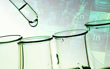 Pipette and test tubes in green tone.
