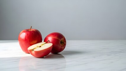 Minimalist still life of fresh apples on a marble table, soft natural light, clean background, copy space