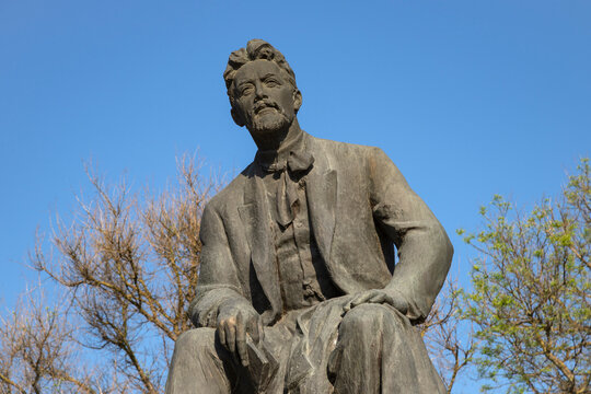 TAGANROG, RUSSIA - MAY 07, 2025: Monument to the Russian writer Anton Pavlovich Chekhov against a blue sky. Taganrog, Rostov region