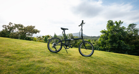 Obraz premium Folding bike on tropical mountain top