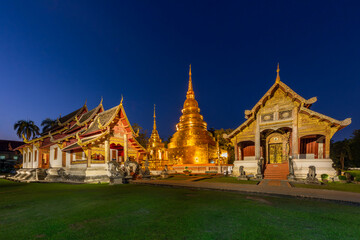 Fototapeta premium Buddhist temple known as Wat Phra Singh at the twilight in Chiang Mai, Thailand.