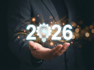 Innovation and strategic planning for 2026, with a glowing lightbulb brain icon symbolizing intelligence, ideas, and future business success.