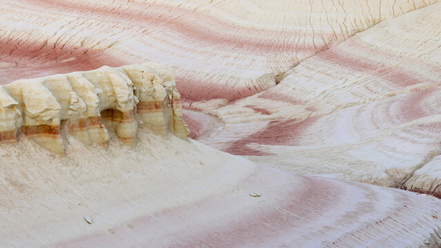 View of soft, pastel-colored rock formations, carved by time, displaying delicate layers of cream and blush, creating a dreamscape, Senek, Mangystau Region, Kazakhstan.