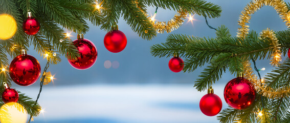 Christmas toys hanging on a snowy fir branch on a bokeh background