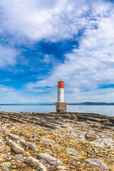 Lighthouse standing on a rocky beach in chemainus, vancouver island