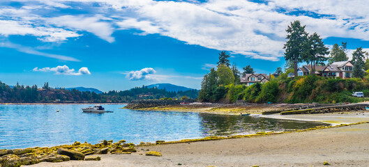 Motorboat sailing near chemainus coastline on vancouver island © unai