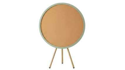 Isolated round corkboard with metal legs and green trim, perfect for office or home use