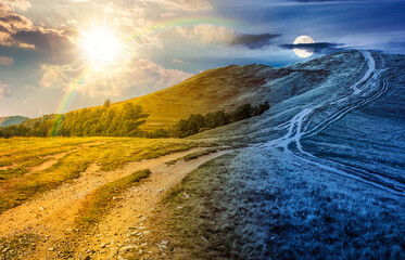 footpath through hills with forest. day and night time change concept. nature scenery in fine early autumn weather with sun and moon. mountain landscape with dirt road. equality and shift template