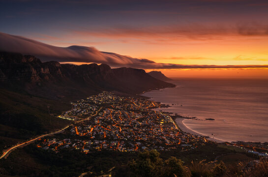 The sunset view point on the Lion head trail with a city light view on Capetown 