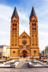 nyiregyhaza, eger, hungary - 07 dec 2014: catholic co-cathedral of our lady of hungary and fountain on kossuth square. beautiful urban landscape of nyiregyhaza before christmas under blue sky