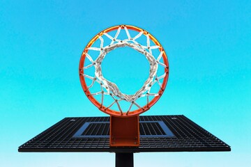 A 3d illustration of a basketball hoop on a blue sky background featuring a digital glass monitor screen and keyboard for online business data communication and network connection technology
