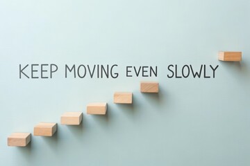 Ascending wooden blocks forming steps with motivational text on a light background, symbolizing gradual progress