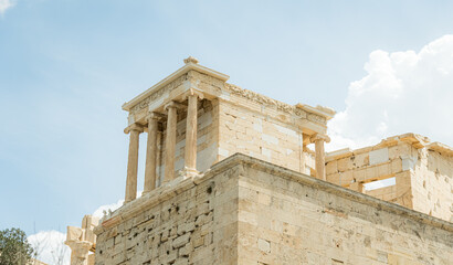 Ancient temple ruins under clear Greek sky