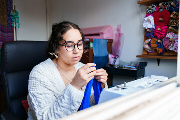 Chilean seamstress working with focus and precision