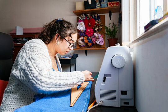 Chilean seamstress working in a creative home studio