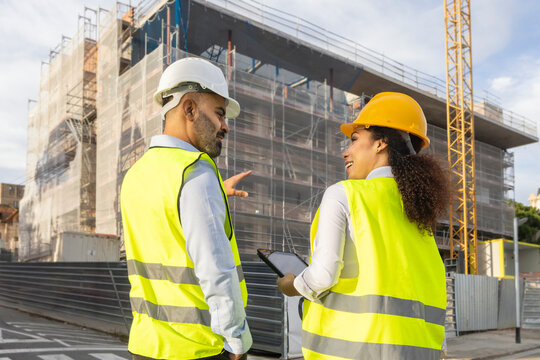 Engineers discuss project at construction site