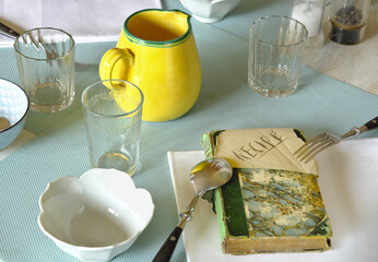 a table set for dining with a vintage recipe book, food and drink cooking and dining concept