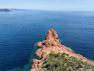 Cliffs on the Cote d'Azur, French Riviera, overlooking Cannes, snow-capped mountains in the background, Drone photo